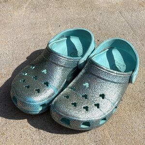 CROCS women’s Disney Shimmering Teal Clogs